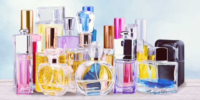 Photo of multiple perfume bottles.